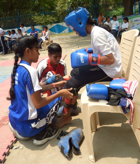 Dipanwita Roy helps Sonia Das get ready for her bout (Photo credit: Swati Sanyal Tarafdar)